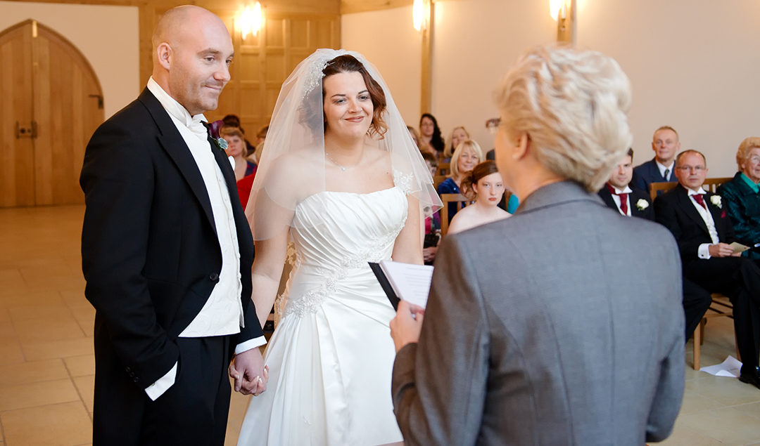 Amber and Craig held hands through their ceremony at Rivervale Barn a stunning wedding venue in Hampshire