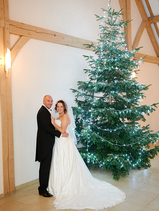 The bride and groom added a Christmas tree to their wedding décor to add on to the winter wedding theme