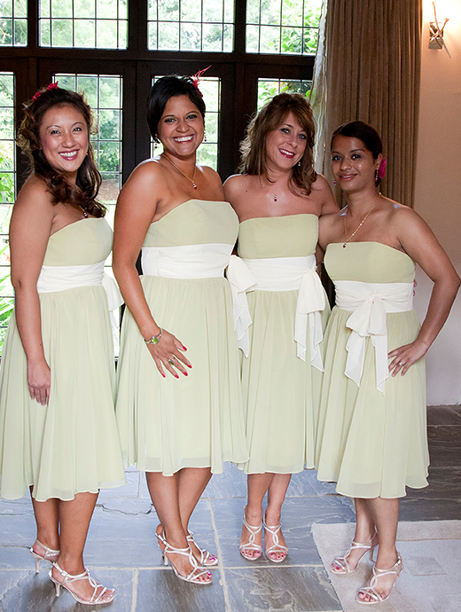 The bridesmaids wore short pale green dresses to match the tropical wedding day theme