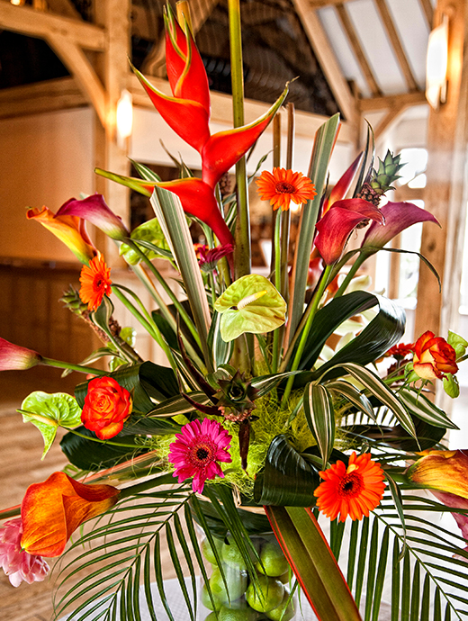 Vibrant flowers were used as focus piece decorations pulling together the stunning tropical inspired wedding day