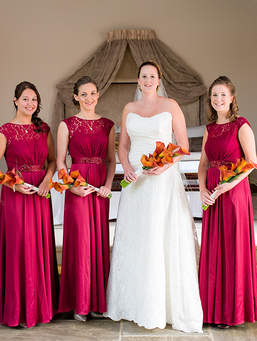 The bridal party looked exquisite with the bridesmaids in a long red gown which complimented their orange lily bouquets