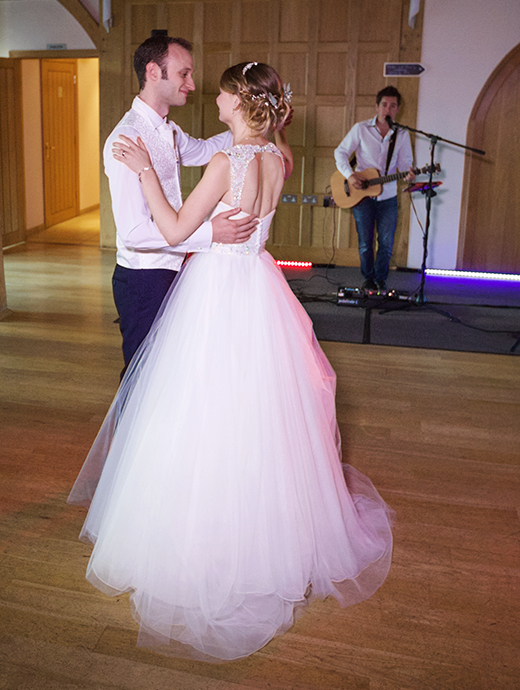 The bride and groom share their first dance at Rivervale Barn one of Hampshire’s most beautiful wedding venues