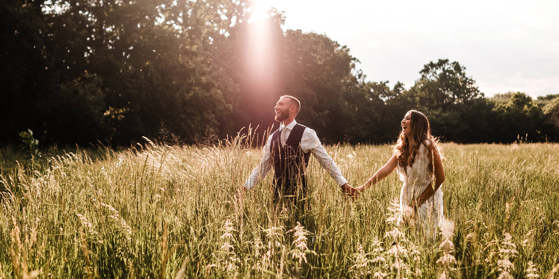 The bride and groom explore the beautiful gardens of this Hampshire wedding venue