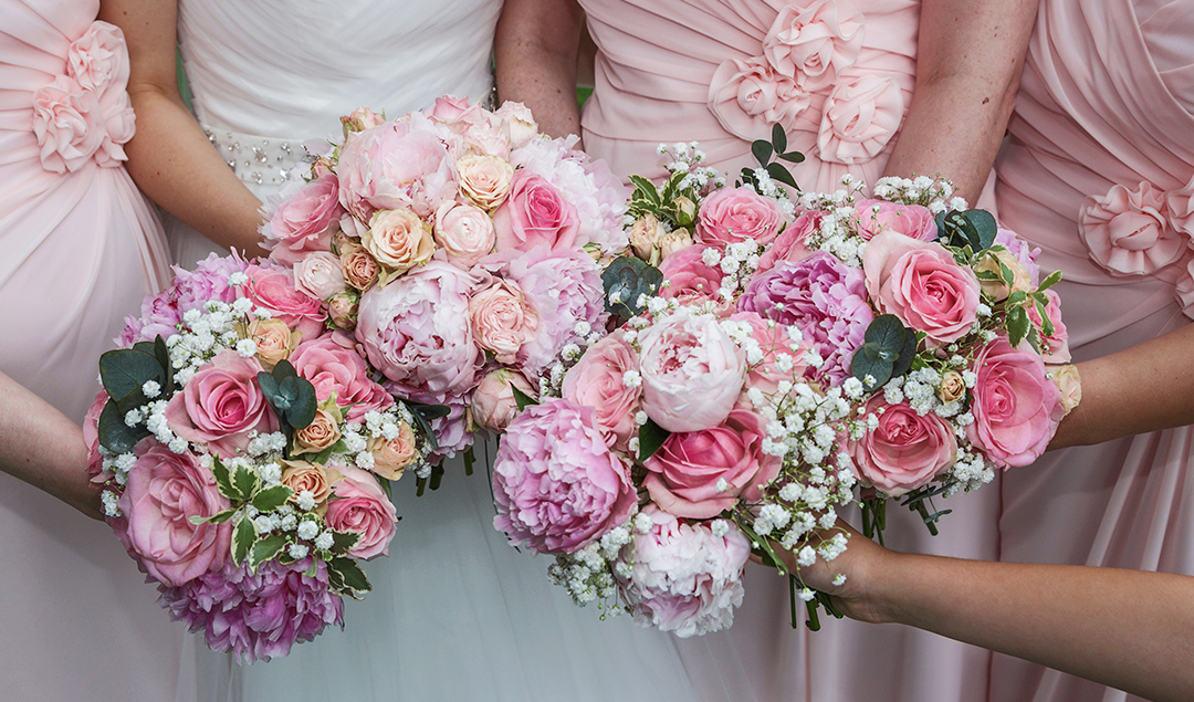 The wedding bouquets were full of vibrant pinks and purples matching the bridesmaids’ dresses perfectly