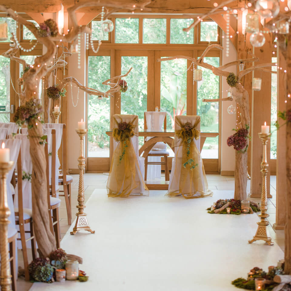 The Ceremony Barn was dressed beautifully in autumn décor at Rivervale Barn in Hampshire