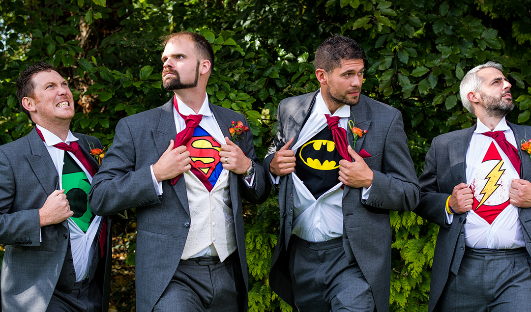 The groomsmen has a surprise under their suits in the form of superheroes at Rivervale Barn in Hampshire