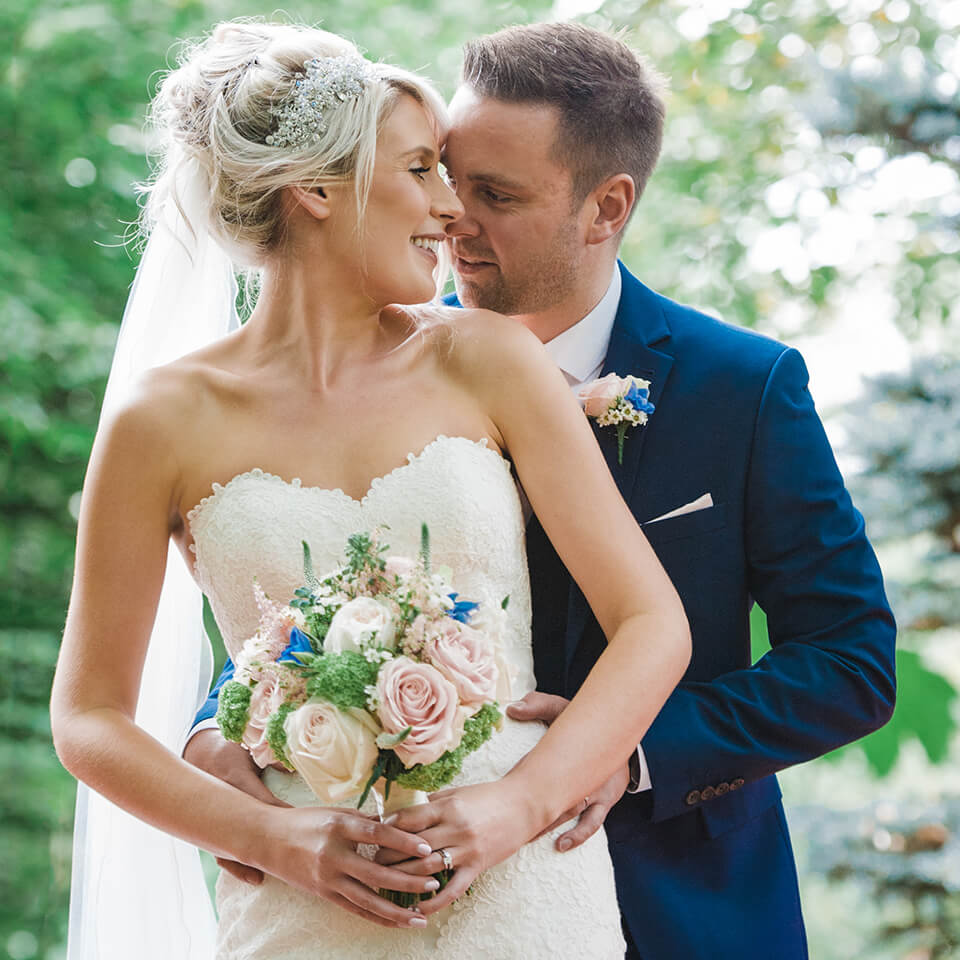 The bride's bouquet was a mix of pale pinks and spots of blue, perfect for a spring wedding
