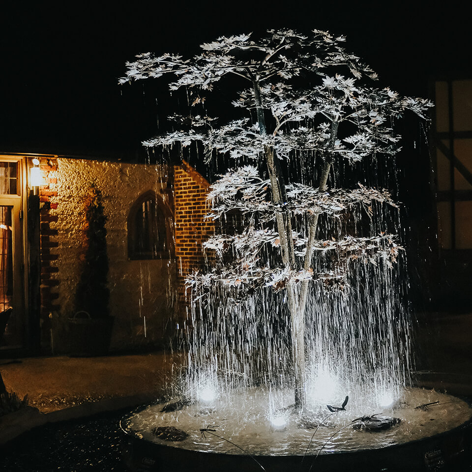 A stunning water feature in the Mediterranean courtyard at one of Hampshire's finest wedding venues