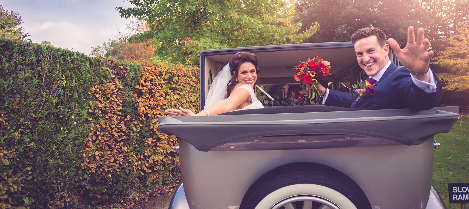 The newlyweds drive away in their vintage wedding car during the evening reception