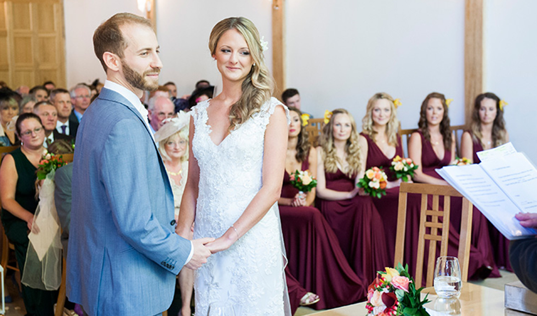 Hayley and Oliver stood hand in hand during their wedding ceremony at one of Hampshire’s most stunning wedding venues