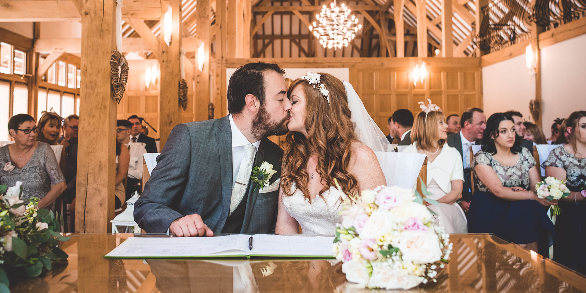 An image of the bride and groom sharing a kiss at their beautiful Hampshire wedding venue