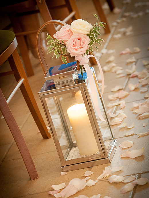 The Ceremony Barn was dress with lanterns and scattered with delicate rose petals