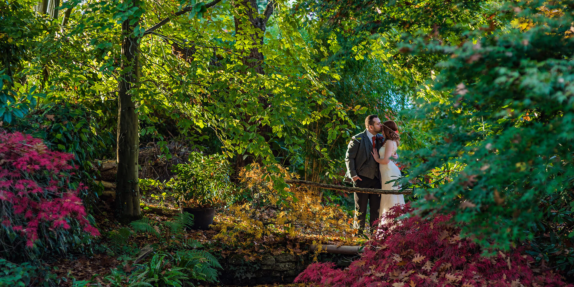 The bride and groom enjoy some time together in the beautiful surrounding gardens of Rivervale Barn