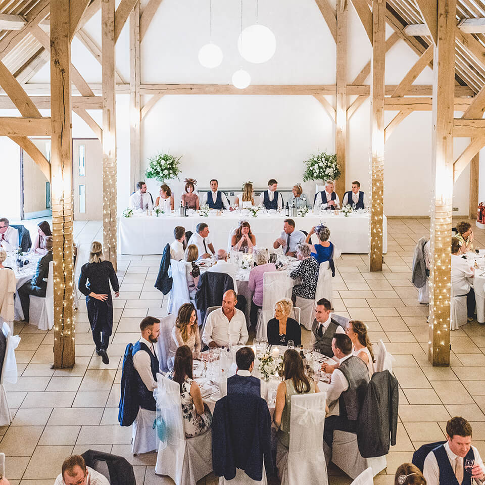 Guests take their seat in the Dining Barn ready to enjoy the wedding breakfast