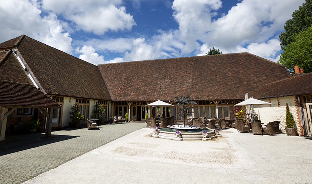 The Courtyard at Rivervale Barn boasts a stunning water feature and plenty of room for guests to relax