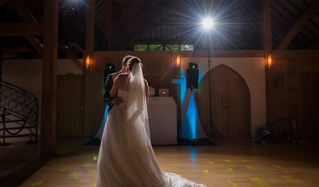 A bride and groom share their first dance and one of Hampshire’s most beautiful country wedding venues