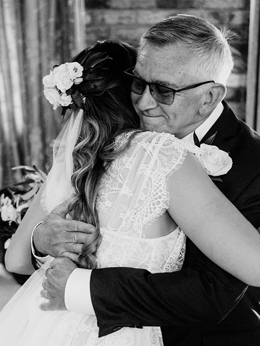 The bride and her father enjoy a special moment before the wedding ceremony at this Hampshire wedding venue