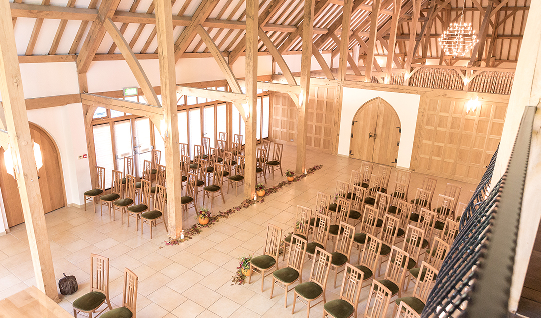 The ceremony barn was dressed with rich coloured flowers to match the autumn theme