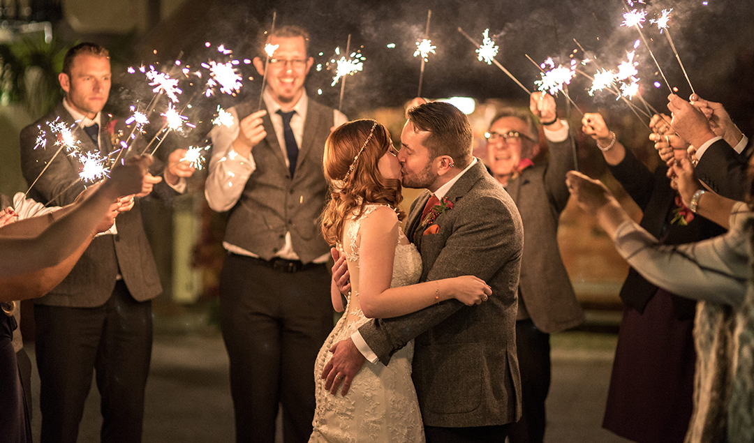 The Newlyweds Shared A Kiss Under Sparkles Lit Up By Family And