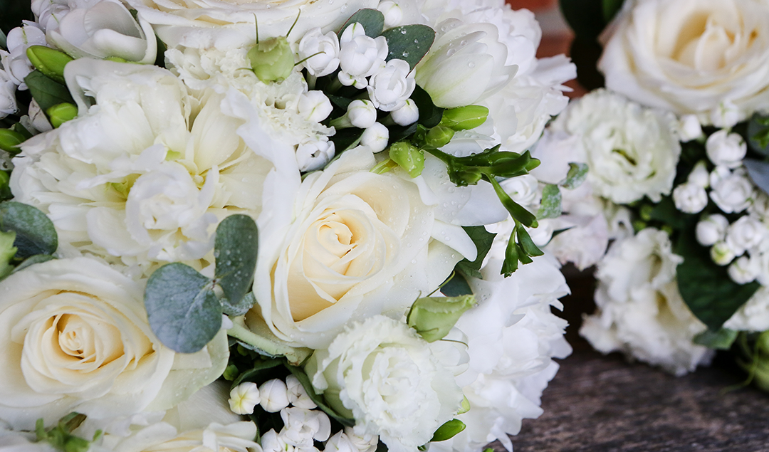 This stunning simple bouquet was full of white roses and delicate ivory ribbons