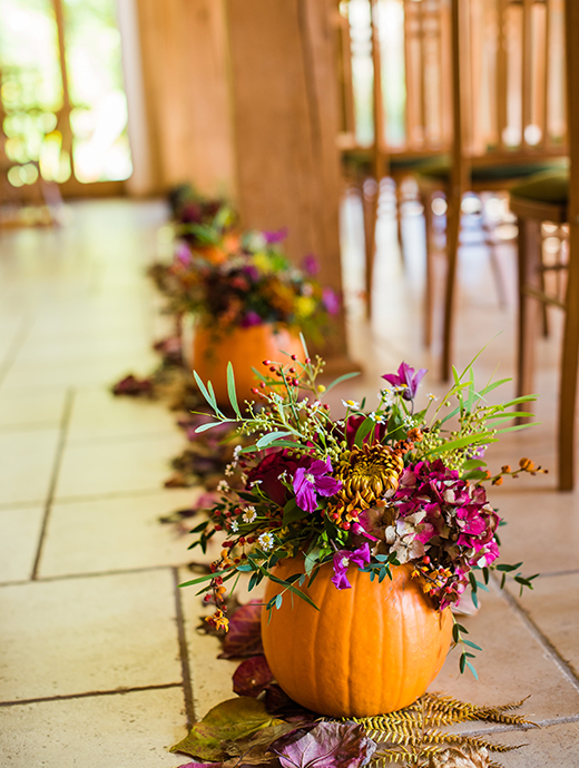 Pumpkins made the perfect holders for the couple’s wedding flowers