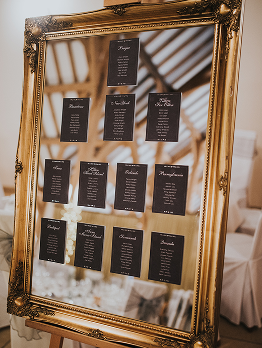 A gold and black table plan made a stunning impact at this winter themed wedding at Rivervale Barn