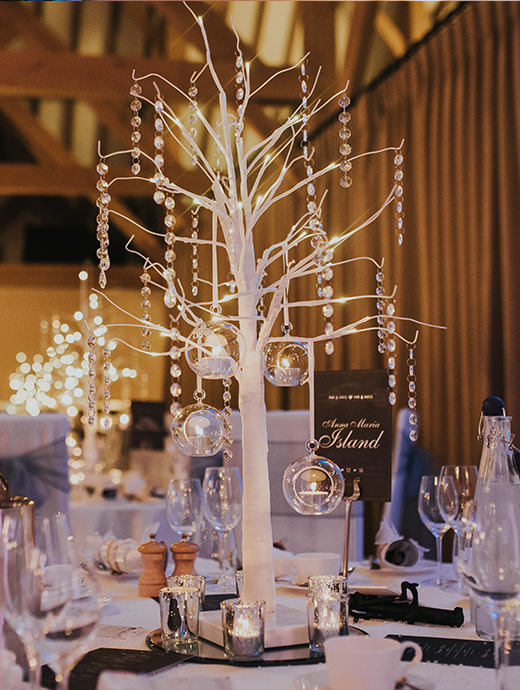 beautifully decorated tree themed table pieces were the focal point for guests during the wedding breakfast