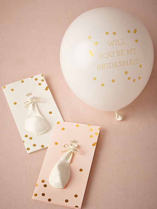 A balloon with a secret message is a fun way to ask your friends to become your bridesmaid