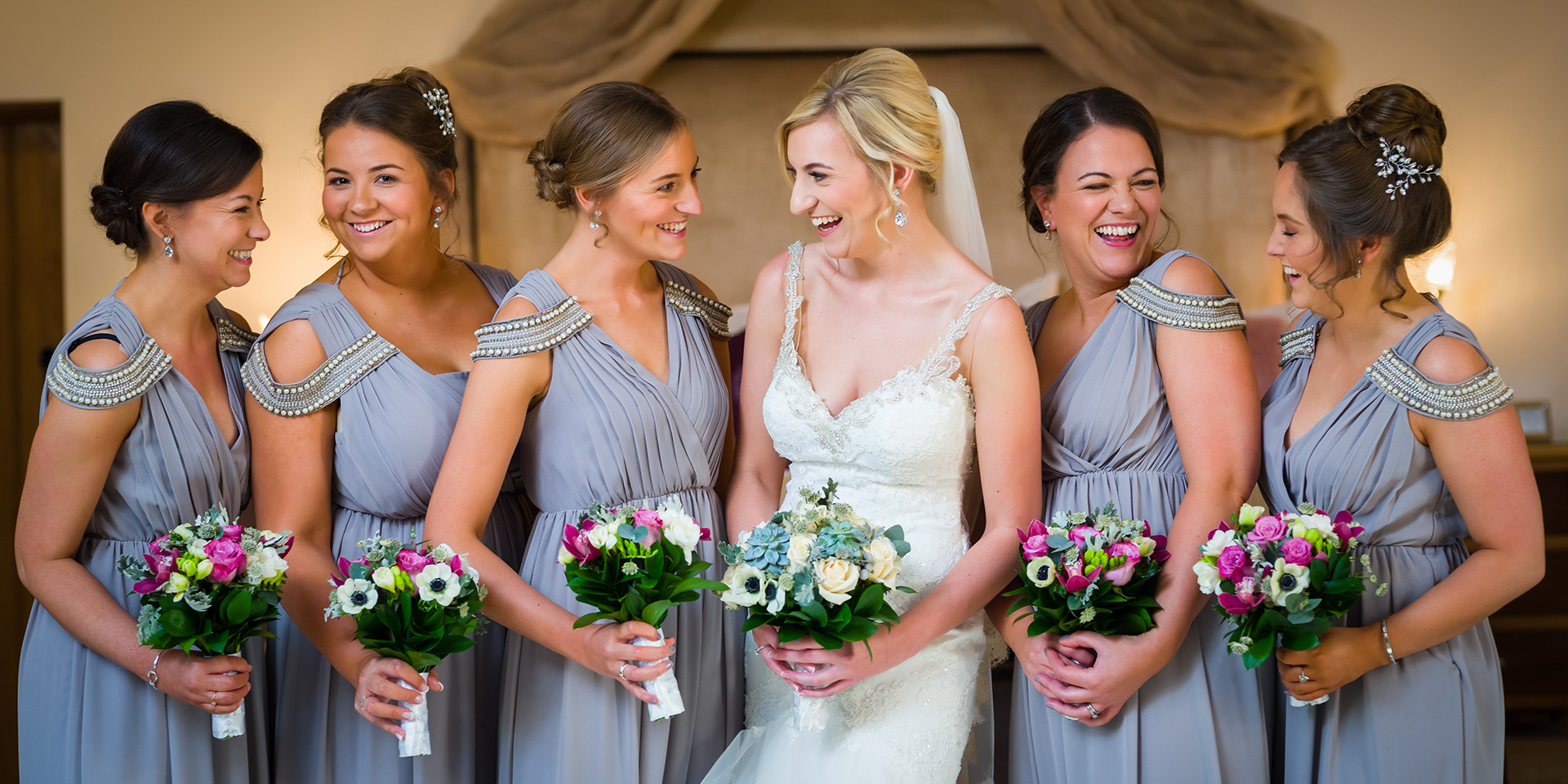 A bride and her bridesmaids ready for a stunning wedding in the beautiful barn venue Rivervale Barn