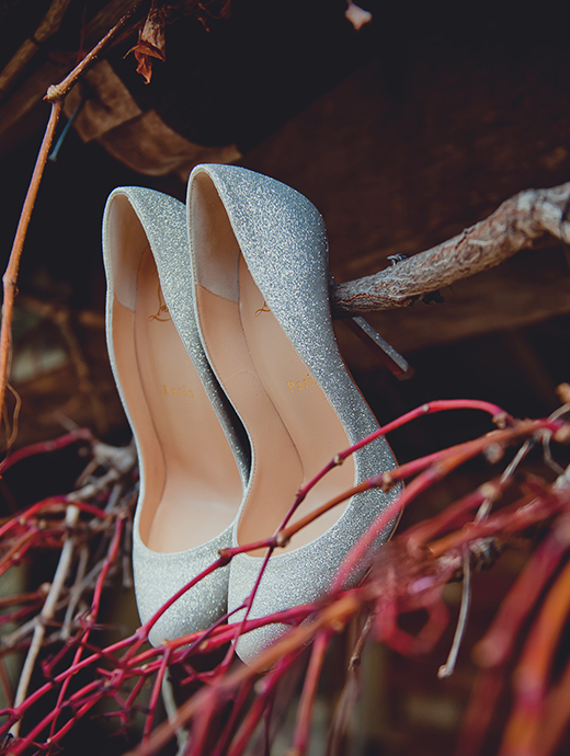 The bride wore sparkling silver shoes on her wedding day at rivervale barn