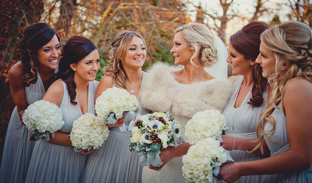 The bridesmaids wore pastel blue dresses, perfect for a winter wedding