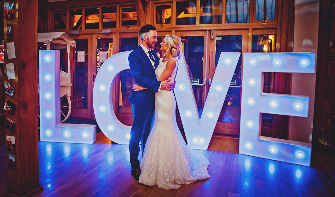 Love letters made a big statement at their beautiful barn wedding in Hampshire