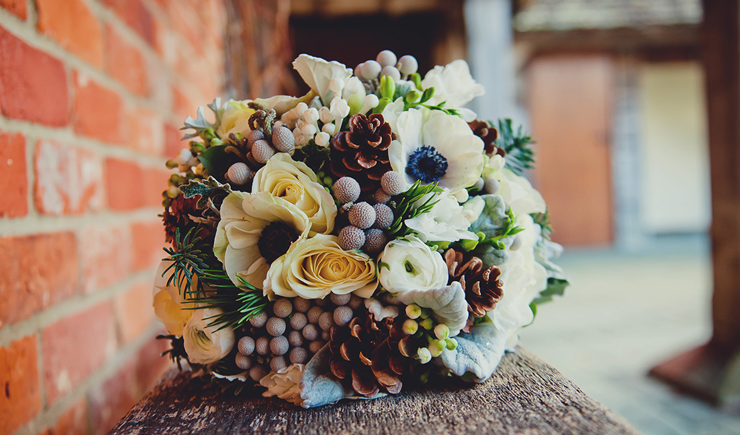 this stunning bouquet had acorns in to compete the wedding theme
