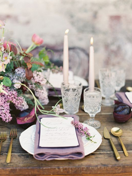 A wedding breakfast table set up with lilac and mauve décor