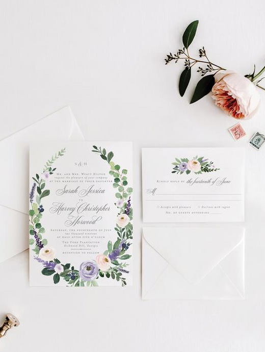 Wedding invites matching the lavender, blue and grey colour scheme of this summer time wedding