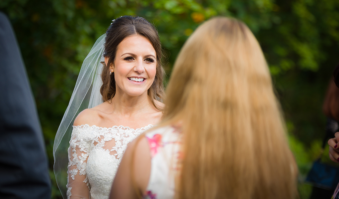 a bride at Rivervale Barn in Hampshire being surprised with a special guest