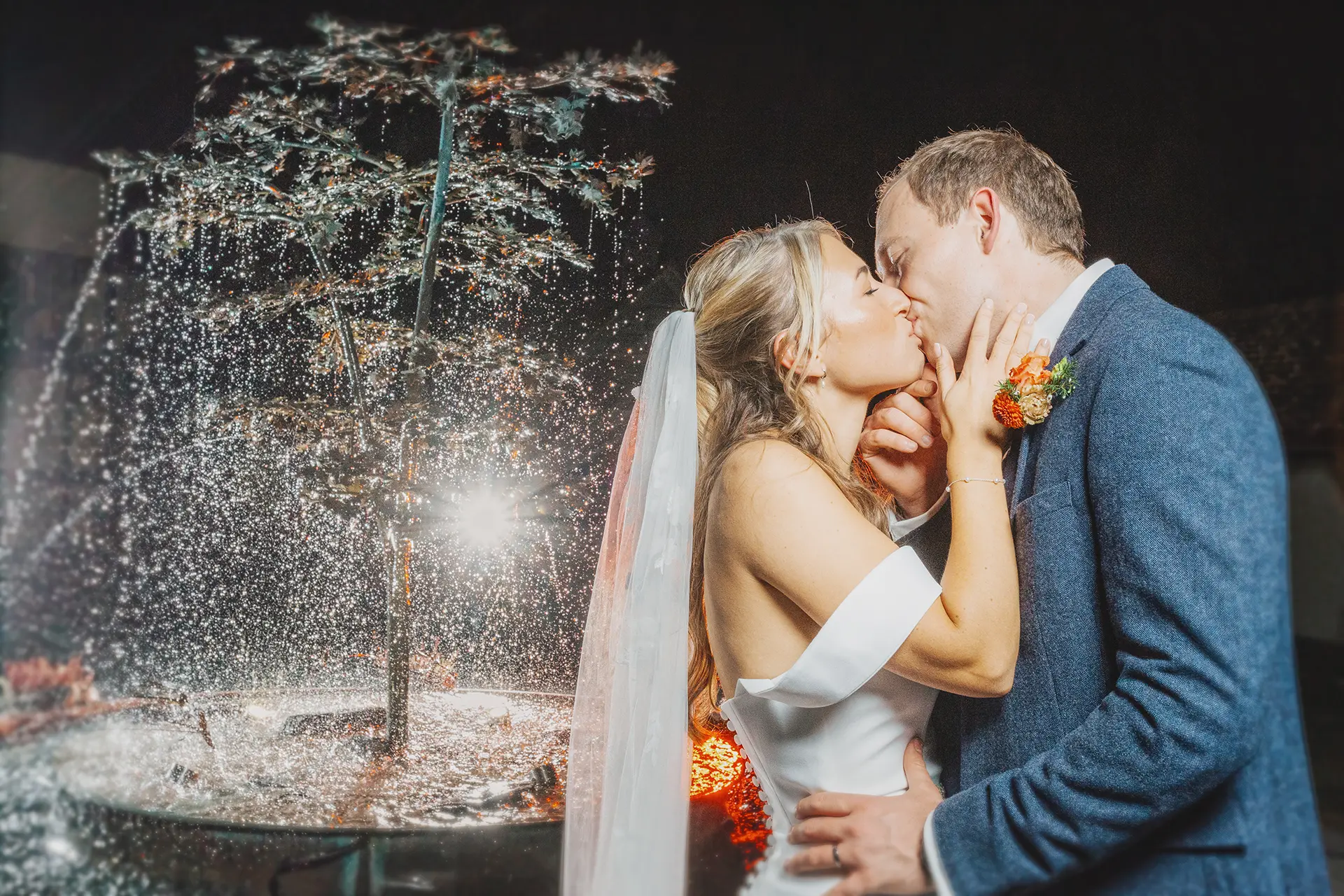 Rivervale Barn romantic backdrop wedding photos couple kissing water fountain
